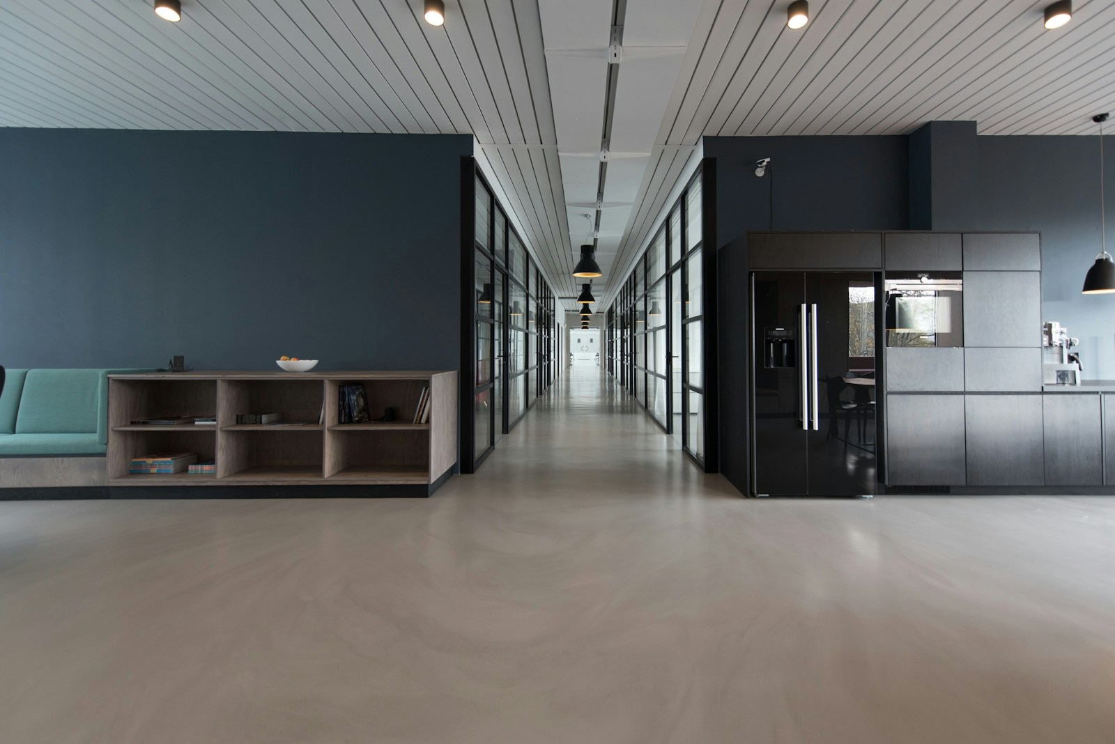 Minimal office interior with sculptural furniture and soft daylight